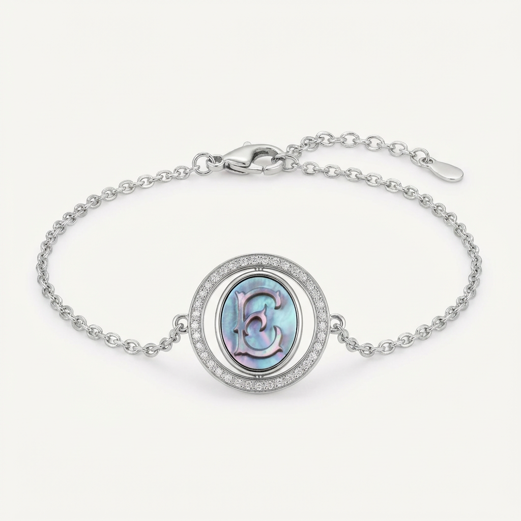 Reversible personalized initial diamond necklace with a black mother-of-pearl background, shown on a 925 sterling silver chain.