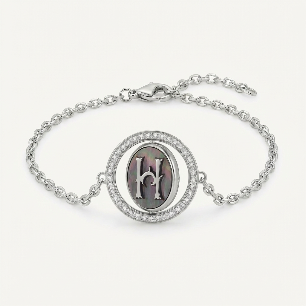 Reversible personalized initial diamond necklace with a black mother-of-pearl background, shown on a 925 sterling silver chain.