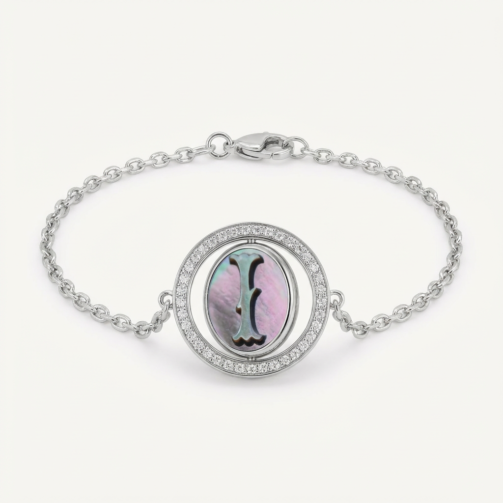 Reversible personalized initial diamond bracelet with a black mother-of-pearl background, shown on a 925 sterling silver chain.