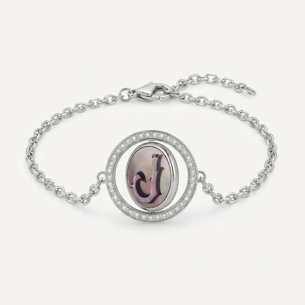 Reversible personalized initial diamond necklace with a black mother-of-pearl background, shown on a 925 sterling silver chain.