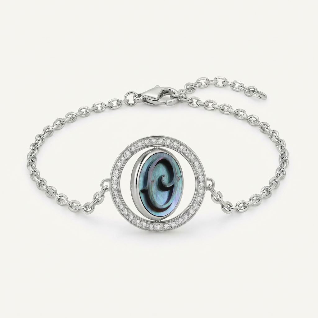 Reversible personalized initial diamond necklace with a black mother-of-pearl background, shown on a 925 sterling silver chain.