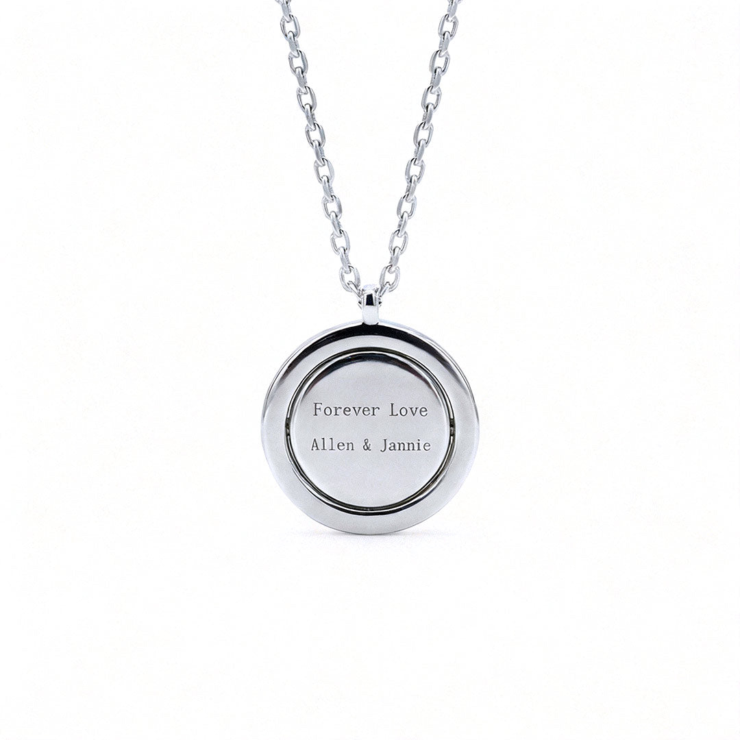 Reversible personalized initial diamond necklace with a black mother-of-pearl background, shown on a 925 sterling silver chain.