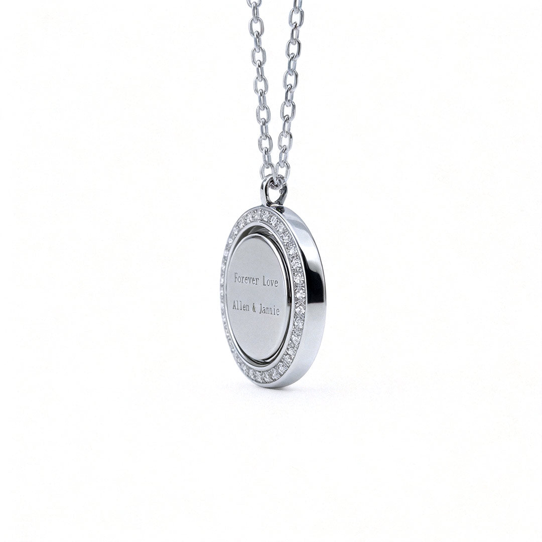 Reversible personalized initial diamond necklace with a black mother-of-pearl background, shown on a 925 sterling silver chain.