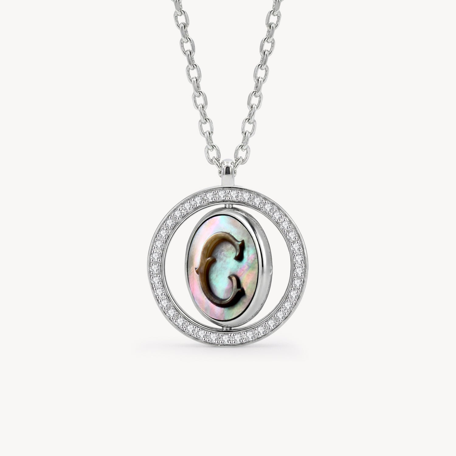 Reversible personalized initial diamond necklace with a black mother-of-pearl background, shown on a 925 sterling silver chain.