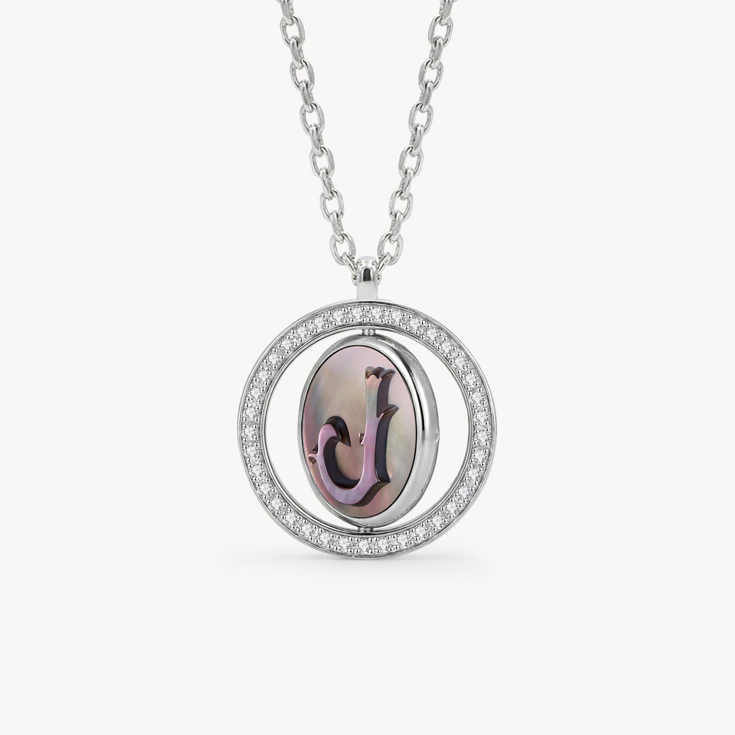 Reversible personalized initial diamond necklace with a black mother-of-pearl background, shown on a 925 sterling silver chain.