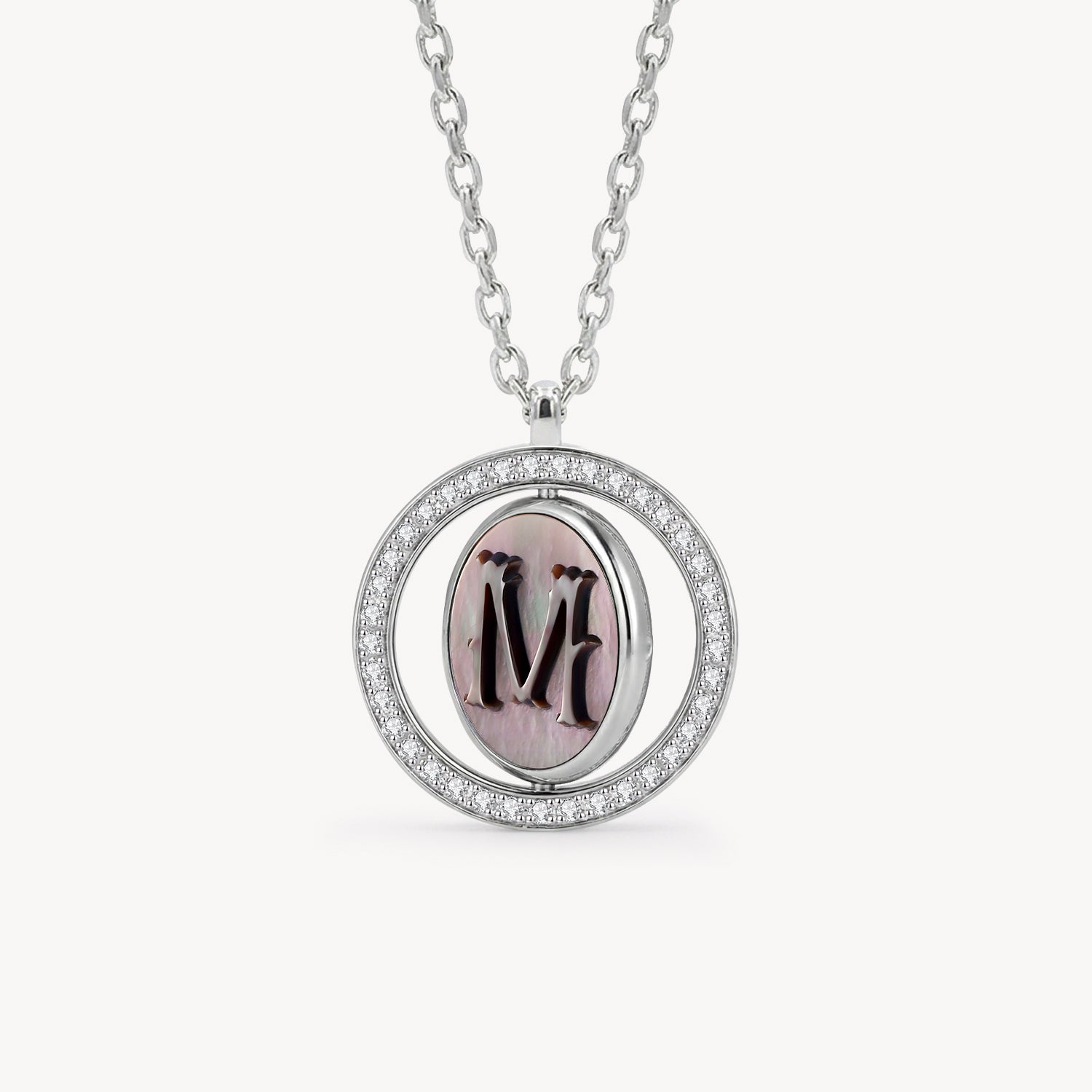 Reversible personalized initial diamond necklace with a black mother-of-pearl background, shown on a 925 sterling silver chain.
