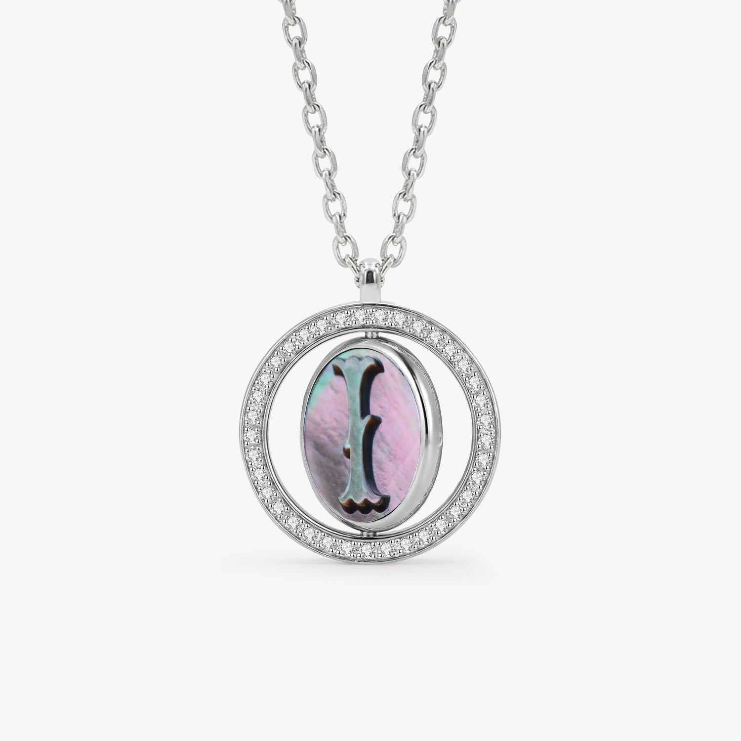 Reversible personalized initial diamond necklace with a black mother-of-pearl background, shown on a 925 sterling silver chain.