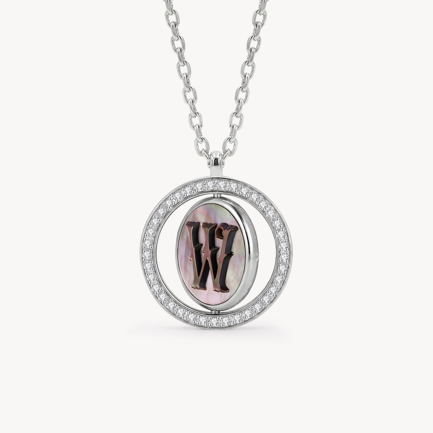 Reversible personalized initial diamond necklace with a black mother-of-pearl background, shown on a 925 sterling silver chain.