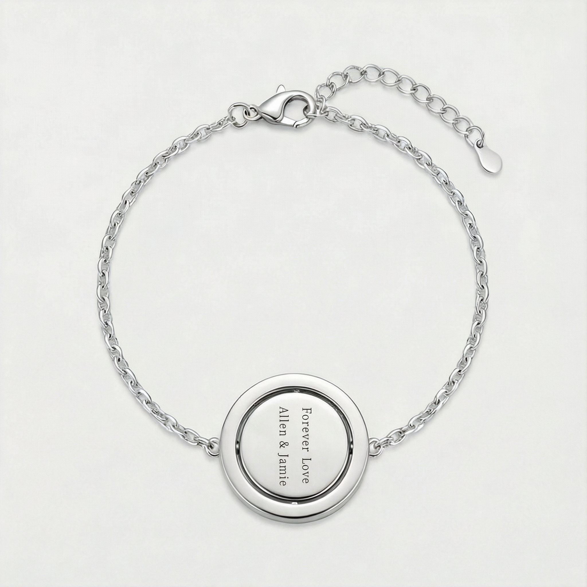 Reversible personalized initial diamond bracelet with a black mother-of-pearl background, shown on a 925 sterling silver chain.