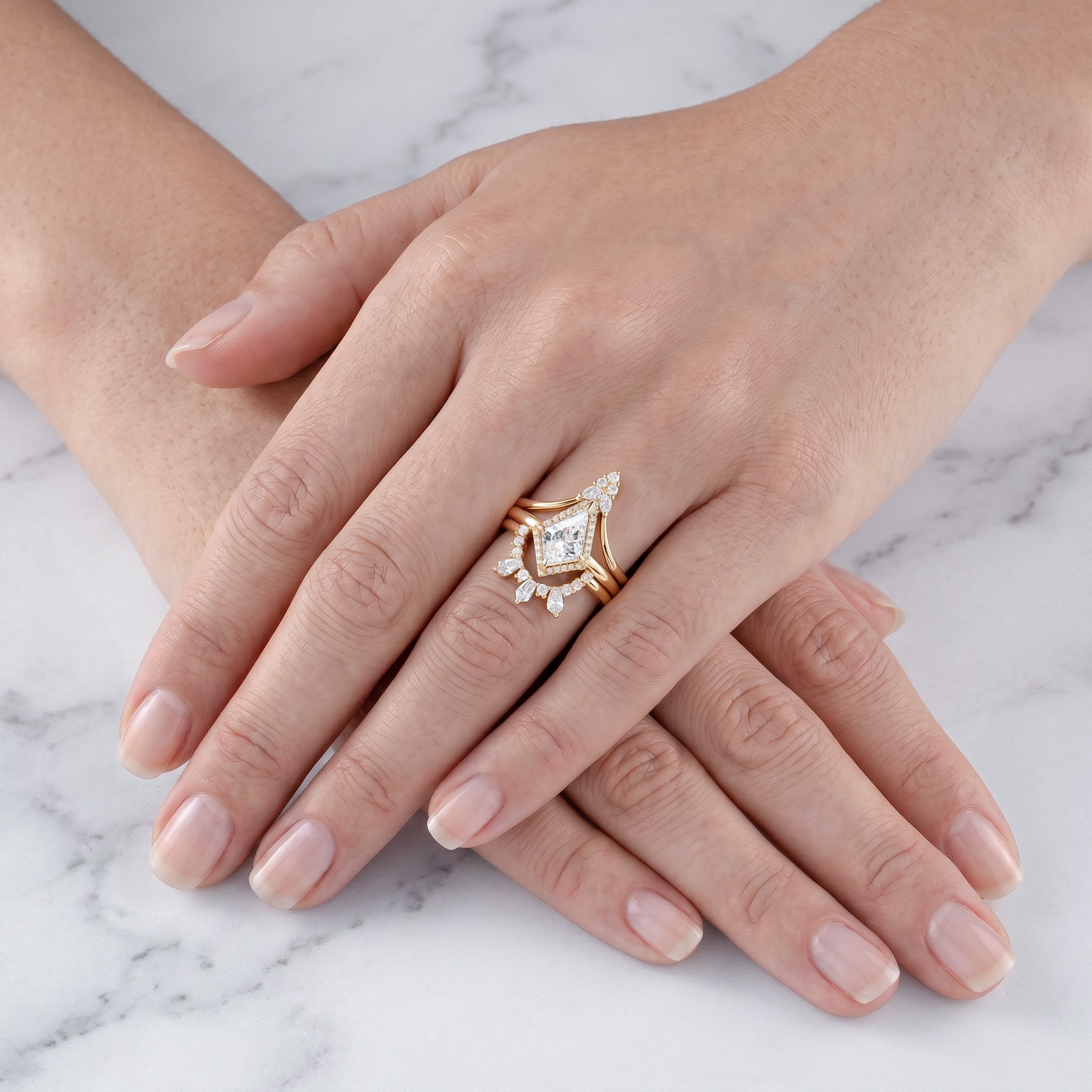 kite shape diamond ring set 3pcs on a marble background
