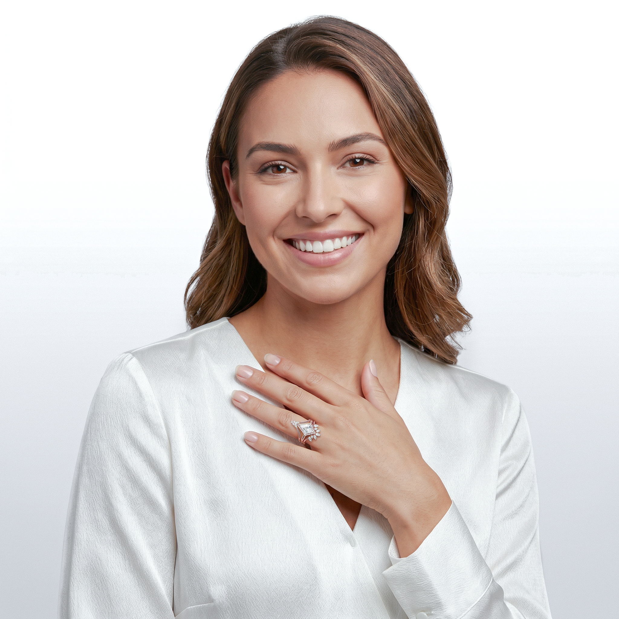 Woman wearing rose gold kite diamond ring set on a plain background