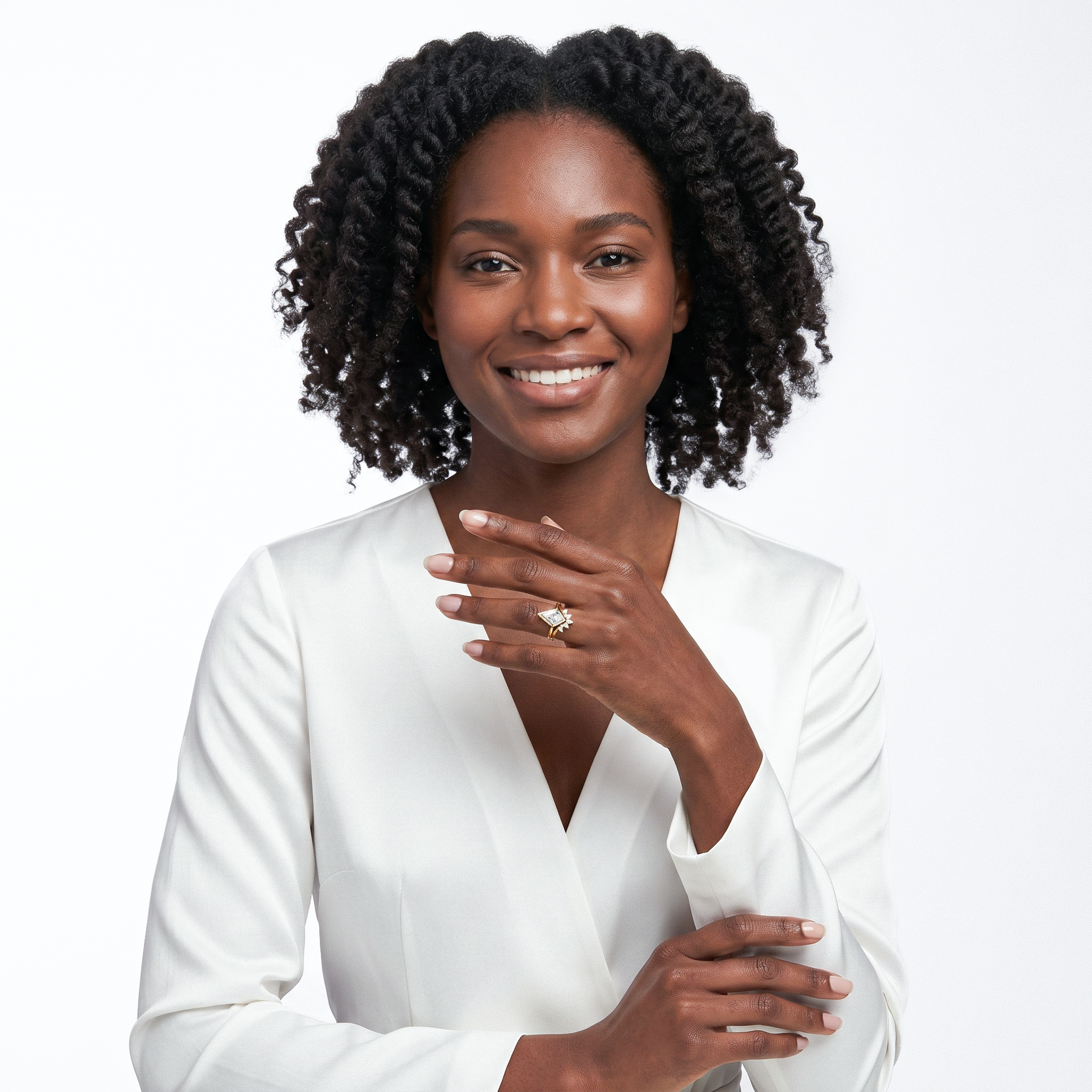 Woman wearing kite cut diamond ring set with a plain background