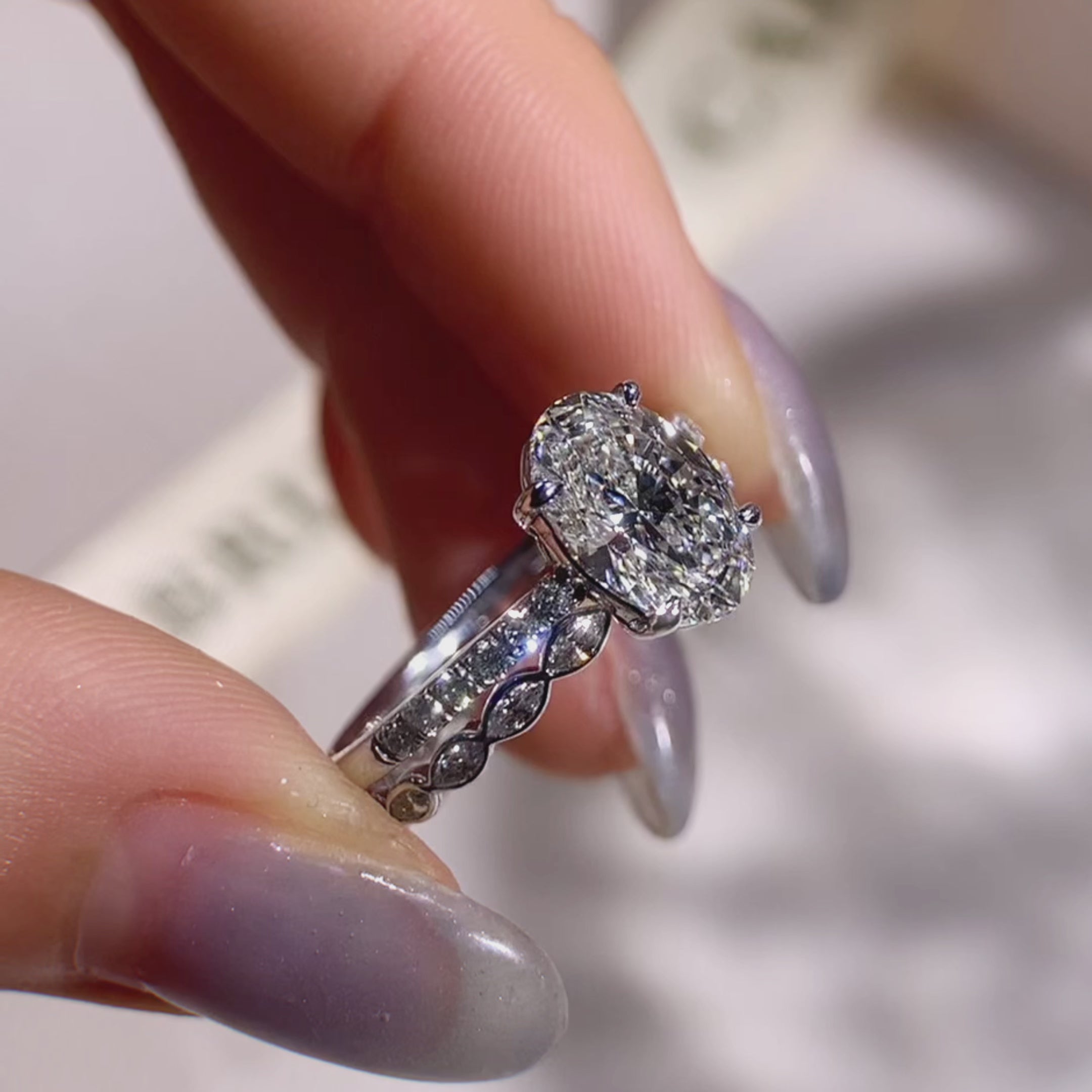 oval diamond ring with marquise diamond band