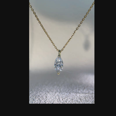 Video showing a marquise-cut solitaire pendant from multiple angles.