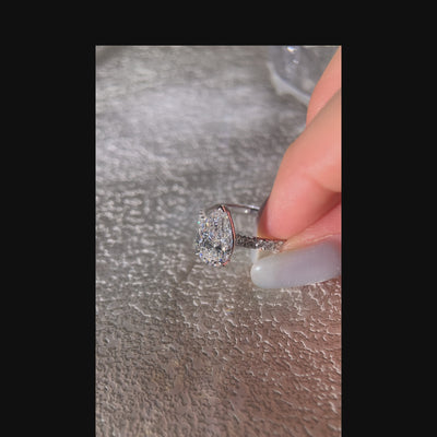 pear diamond  pave ring on hand