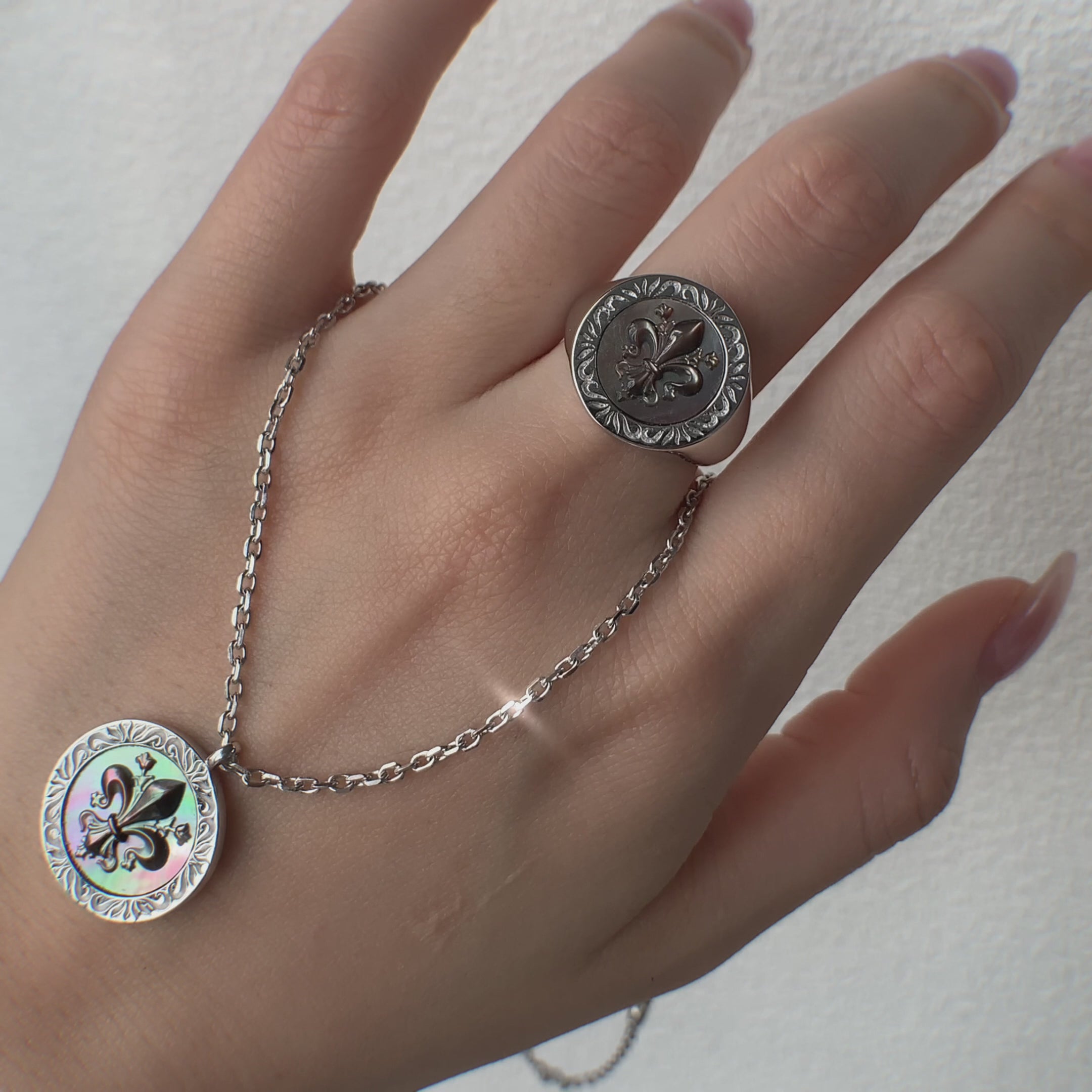 wrearing mother of pearl Silver  ring and necklace with Iris Patten