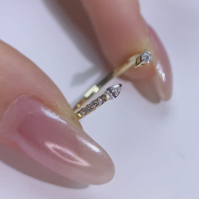 holidng a pear shap diamond band in Minimalist Style
