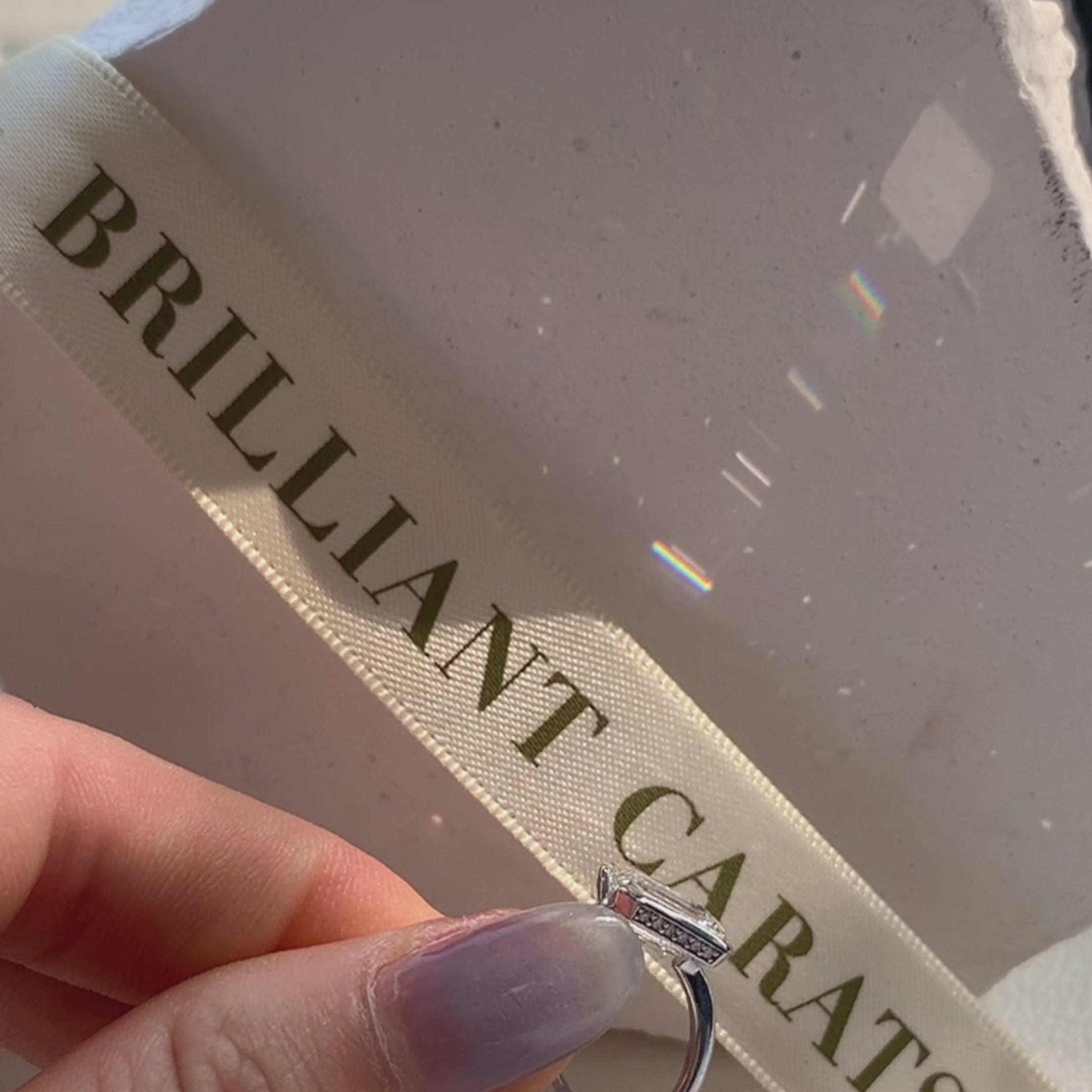 hidden halo emerald cut diamond ring 