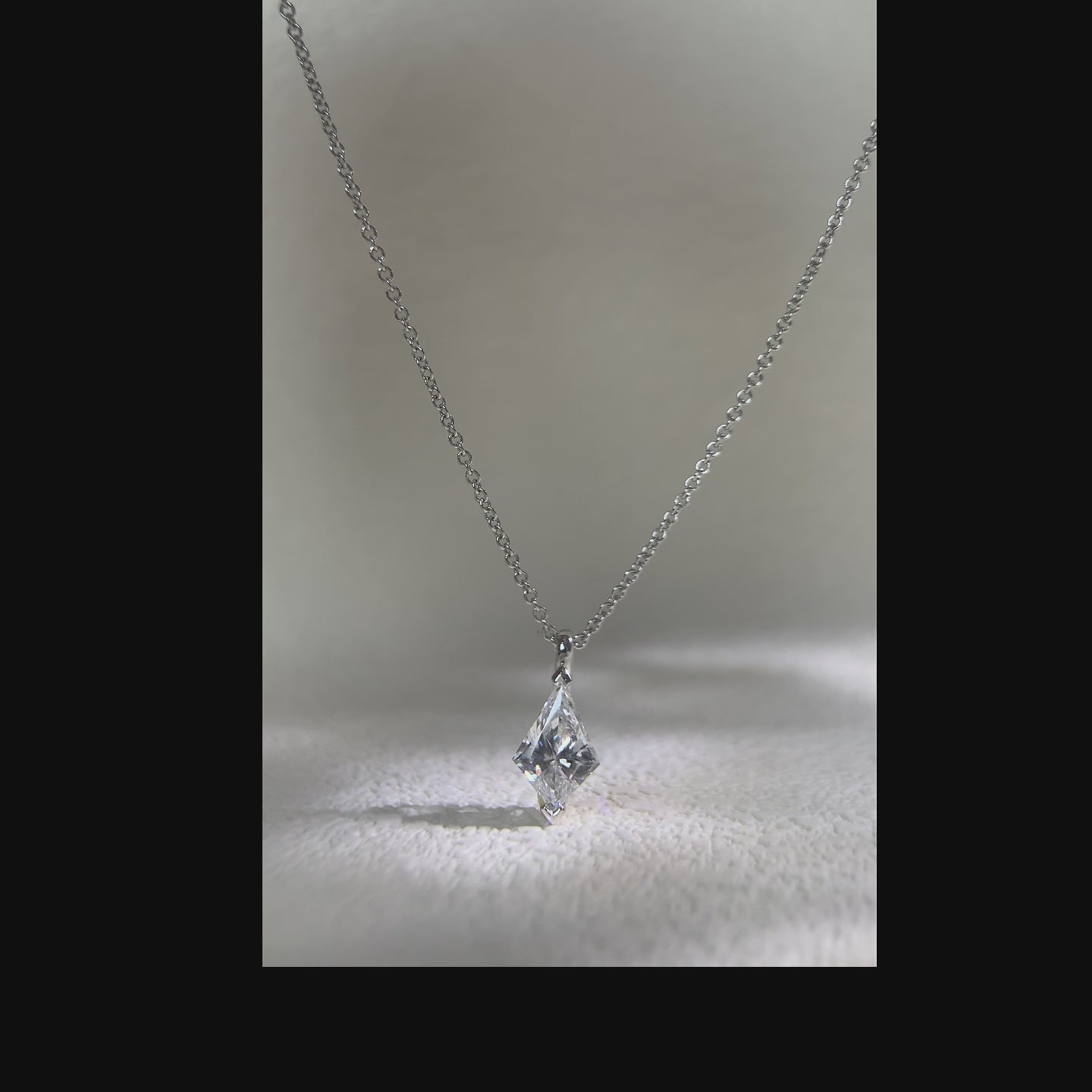 Video showing a kite-cut solitaire pendant from multiple angles.